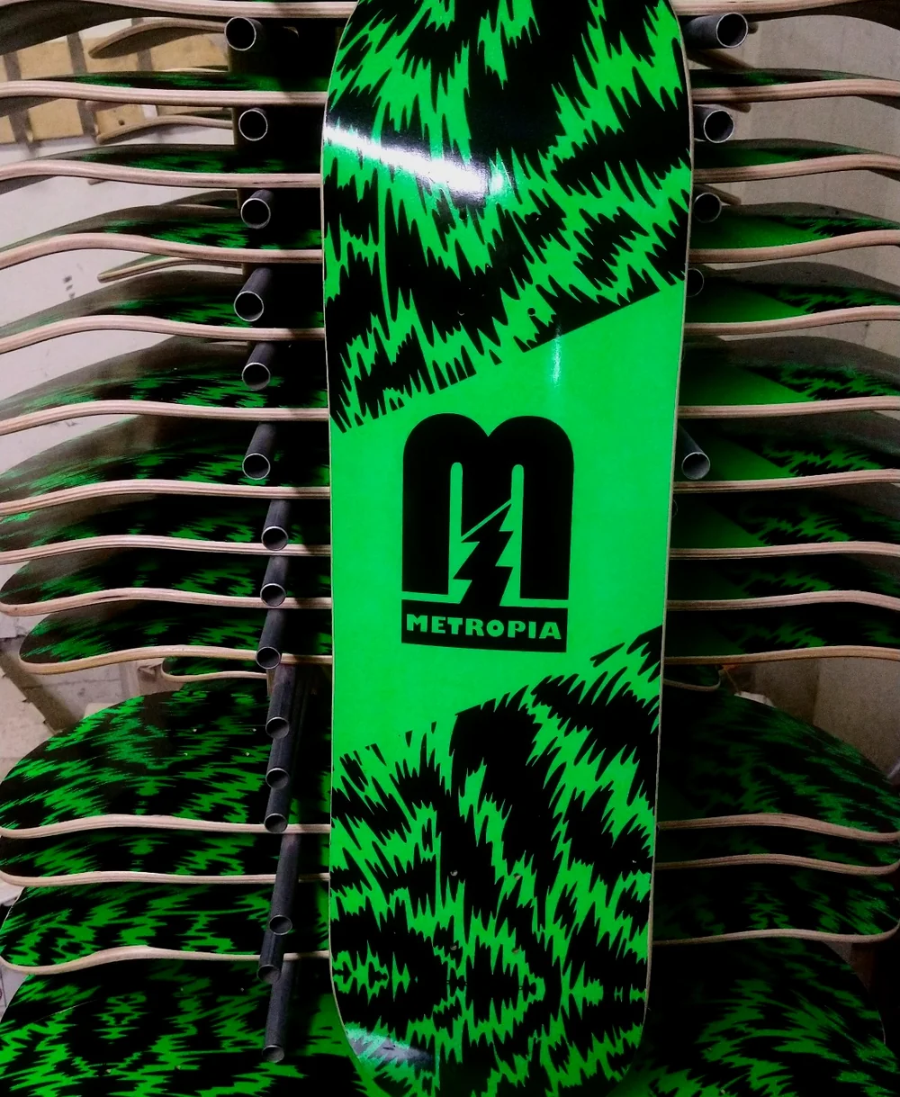 Green and black printed skateboard production example