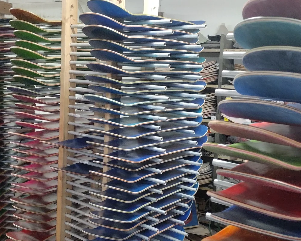 Finished blank skateboard decks on factory racks