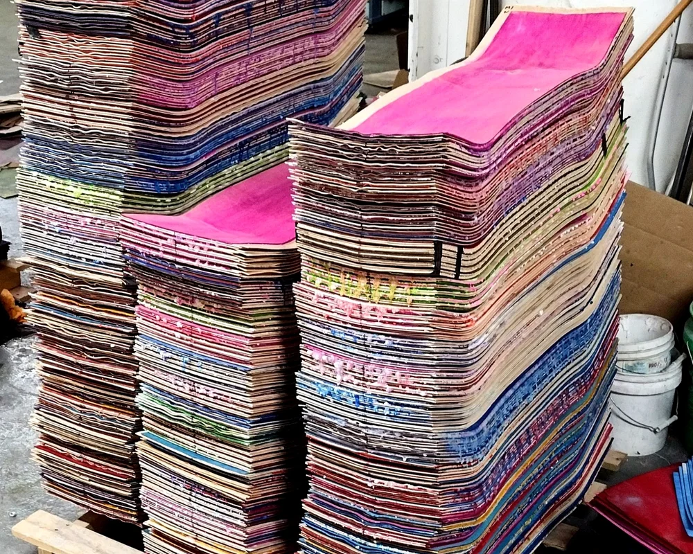 Freshly pressed uncut skateboard decks at Empire