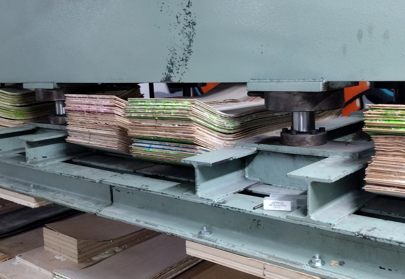 Skateboard decks loaded in production molds