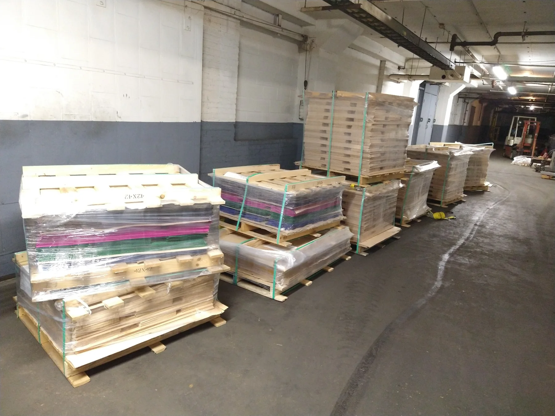 Pallets of skateboard veneer at Empire